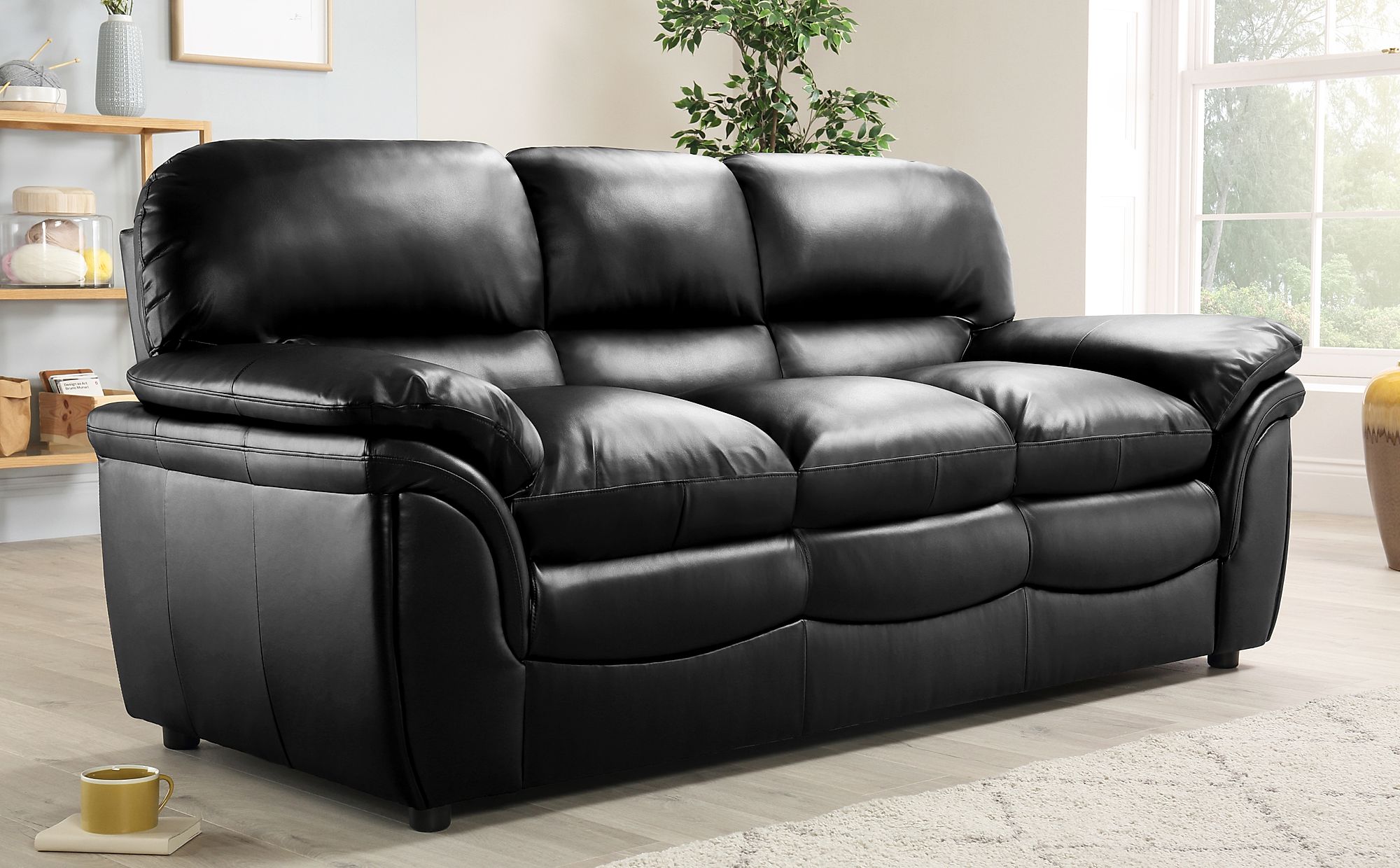 black leather sofa with bed