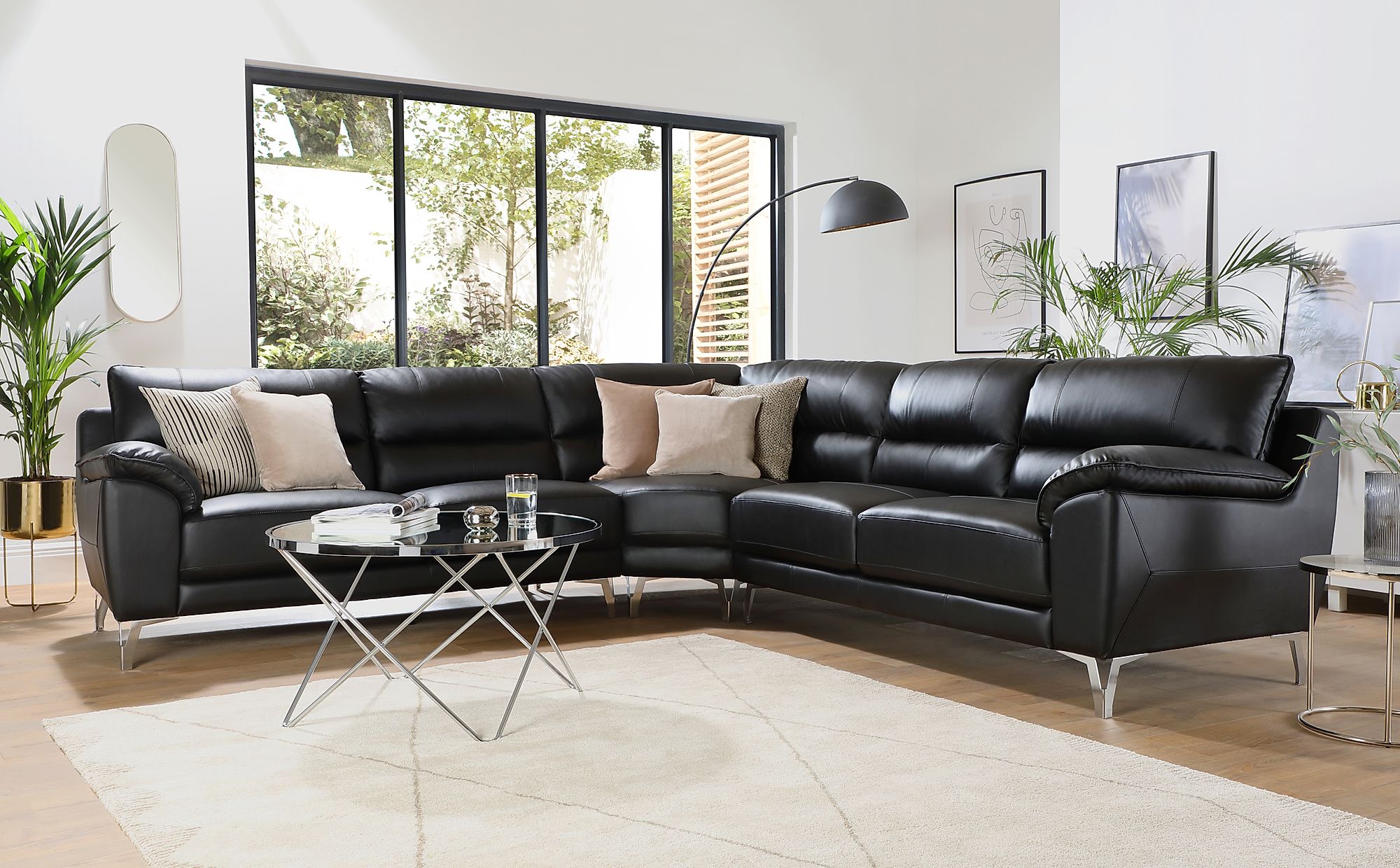 black leather corner sofa with white stitching