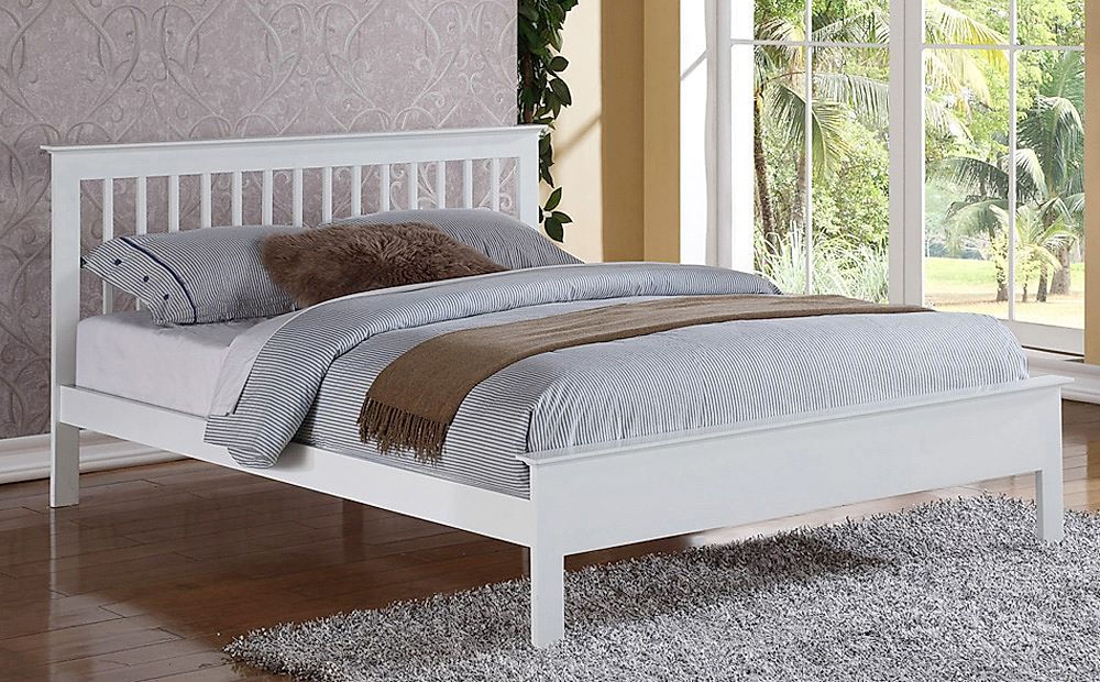 white wooden single bed with mattress