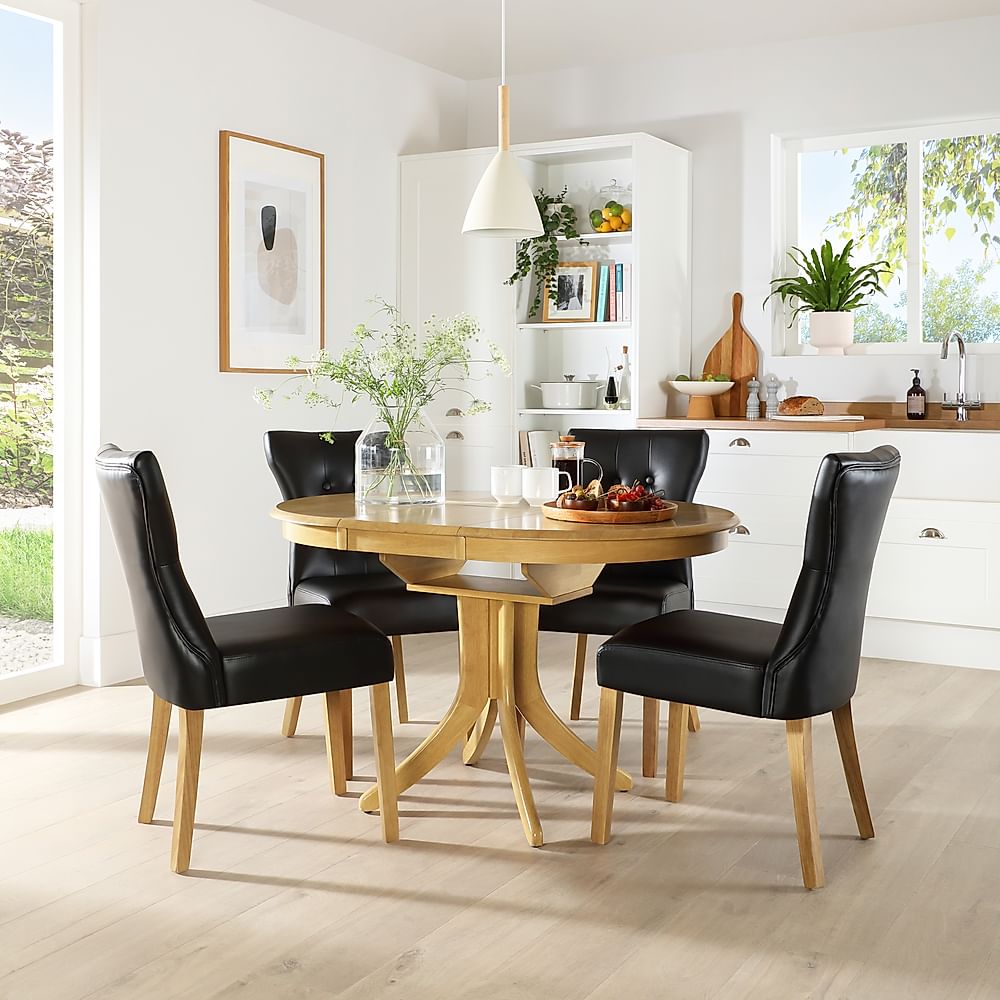 Hudson Round Extending Dining Table & 4 Bewley Chairs, Natural Oak Finished Solid Hardwood, Black Classic Faux Leather, 90-120cm