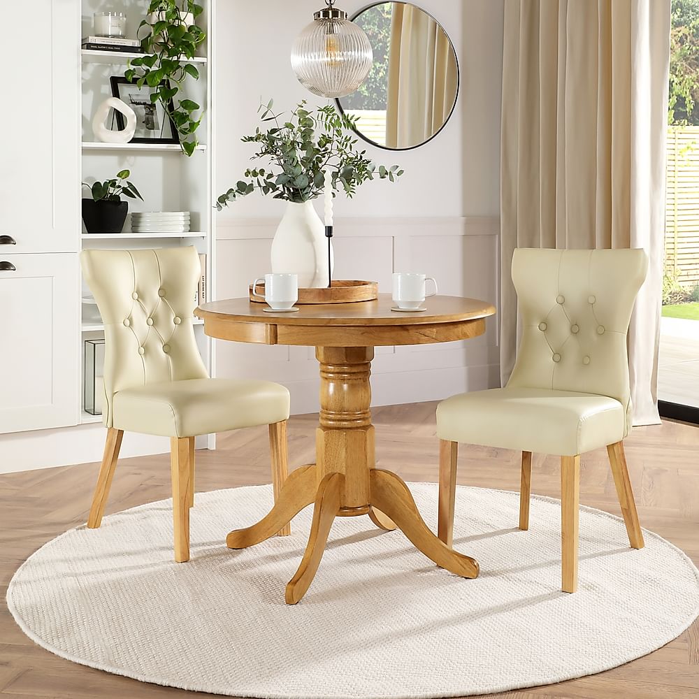 Kingston Round Dining Table & 2 Bewley Chairs, Natural Oak Finished Solid Hardwood, Ivory Classic Faux Leather, 90cm