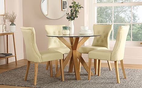 Hatton Round Dining Table & 4 Bewley Chairs, Glass & Natural Oak Finished Solid Hardwood, Ivory Classic Faux Leather, 100cm