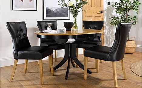 Hudson Round Extending Dining Table & 6 Bewley Chairs, Natural Oak Finish & Black Solid Hardwood, Black Classic Faux Leather & Natural Oak Finished Solid Hardwood, 90-120cm