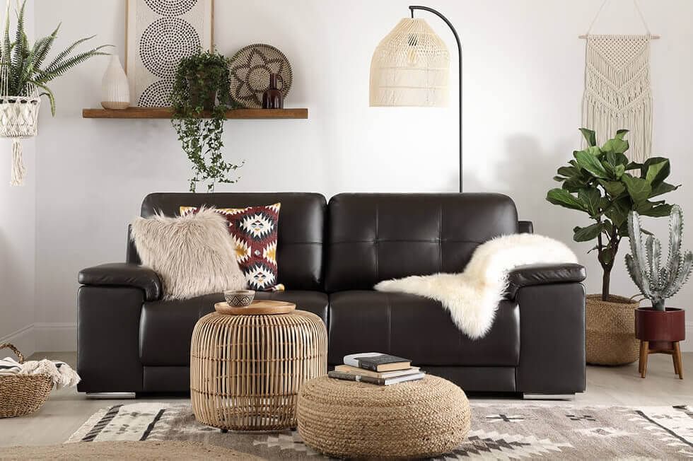 Brown leather sofa in modern boho living room