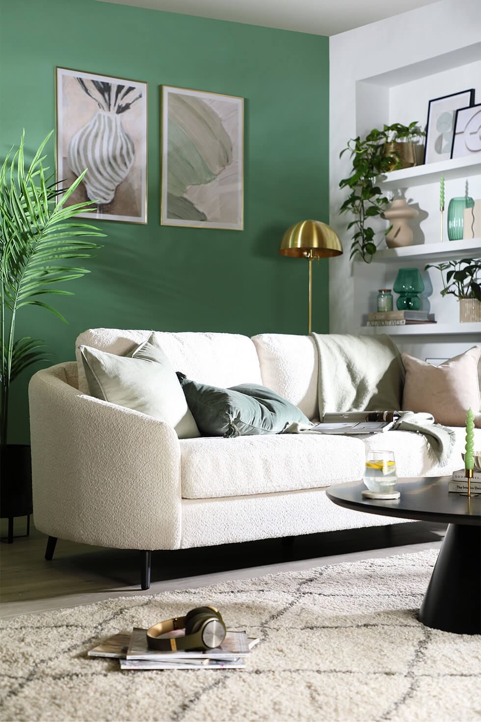 Cream living room with sage green feature wall