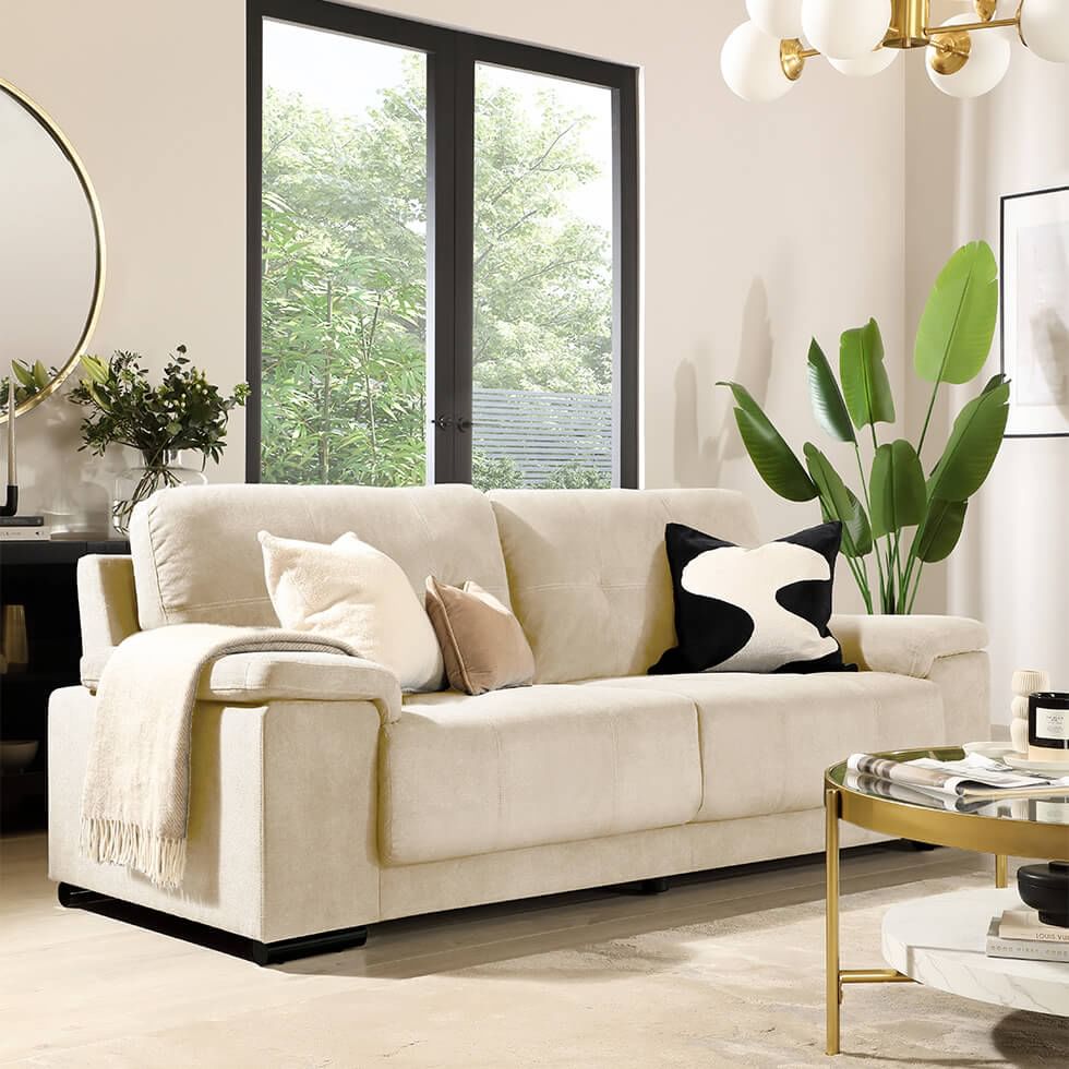 Stylish cream living room with layered neutrals accessories