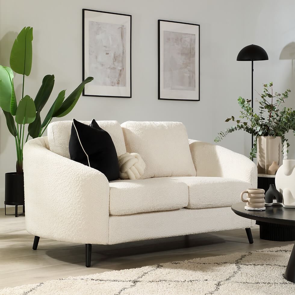 Neutral living room with cream sofa and grey walls