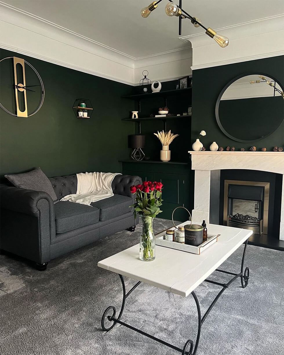 Living room with dark and moody green palette