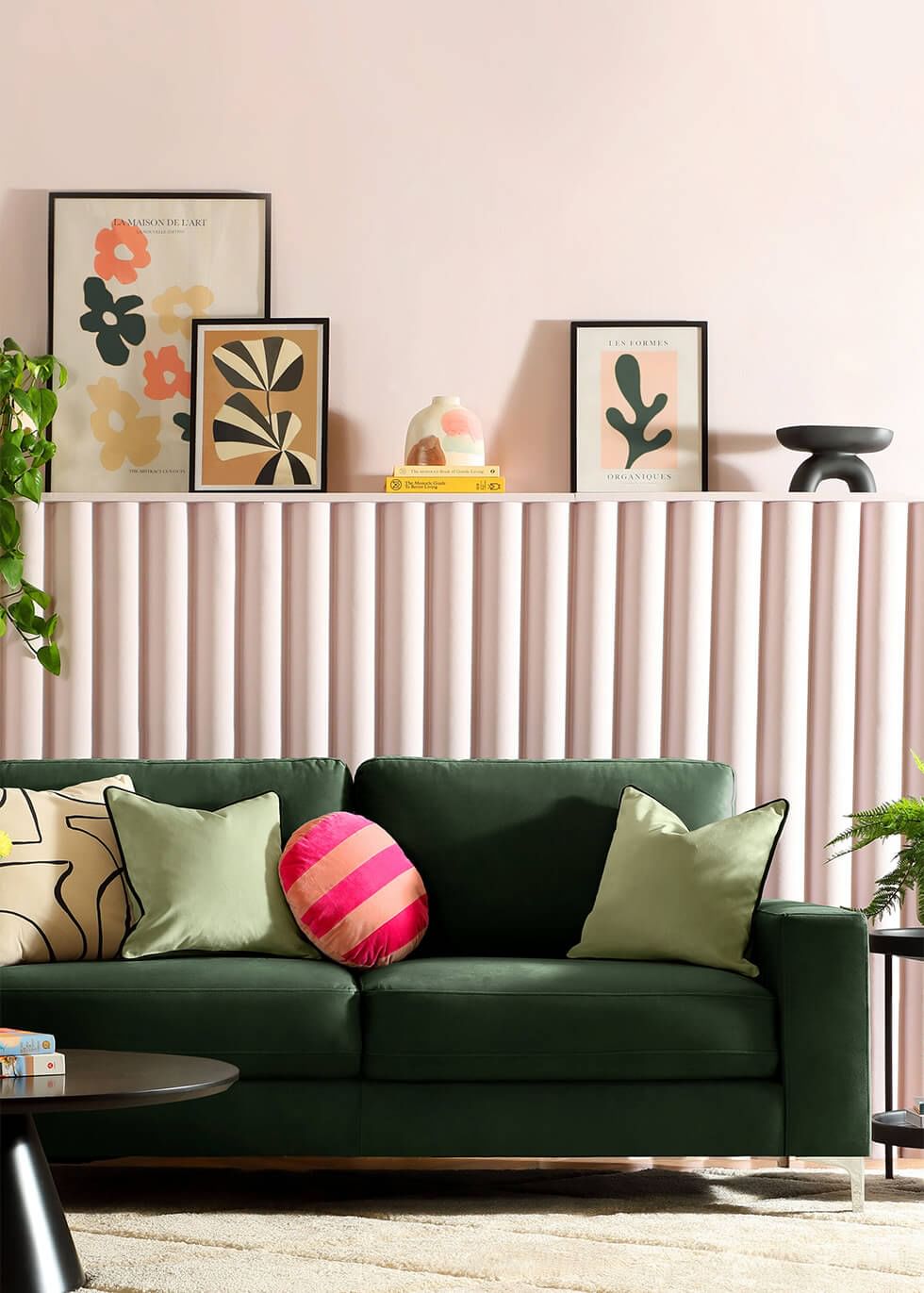 Retro-inspired living room with green and pink colour blocking