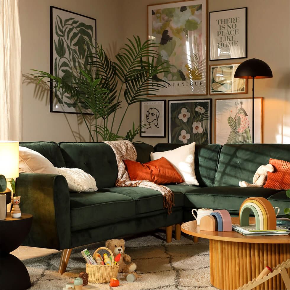 Green living room with vibrant gallery wall