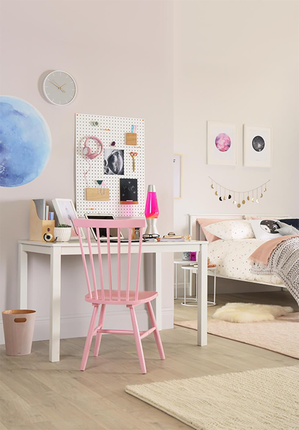 Pink Windsor chair in a soft white bedroom