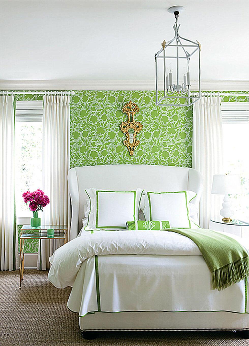 Lime green bedroom with cosy white bedding in a classic mid-century style.