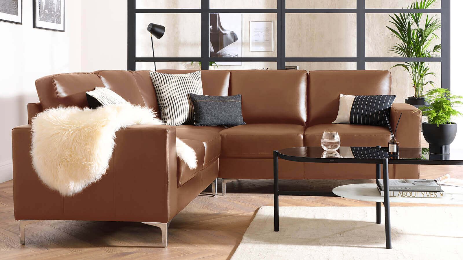 brown leather sofa on hardwood floor