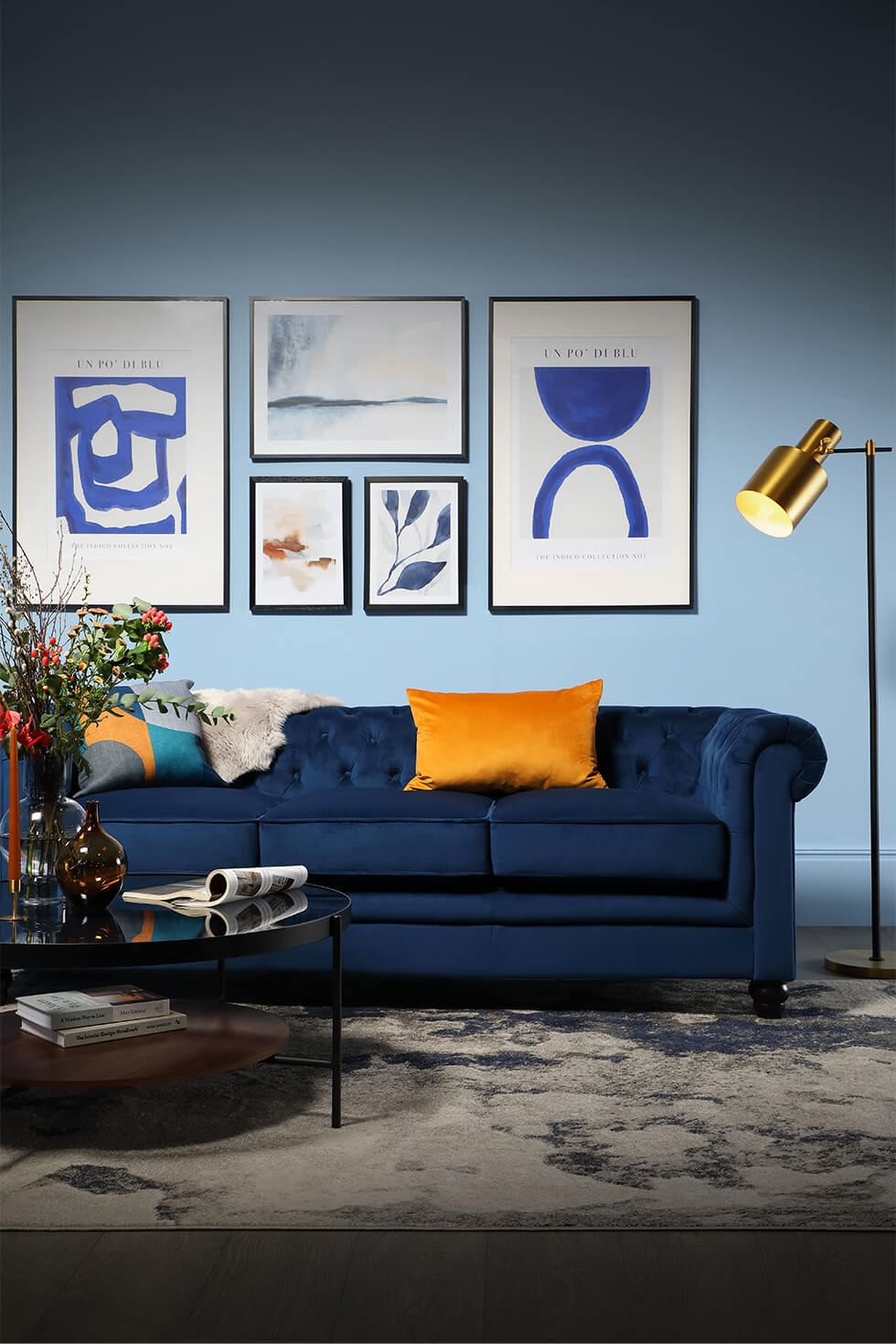 Blue living room with blue sofa sofa and yellow accents