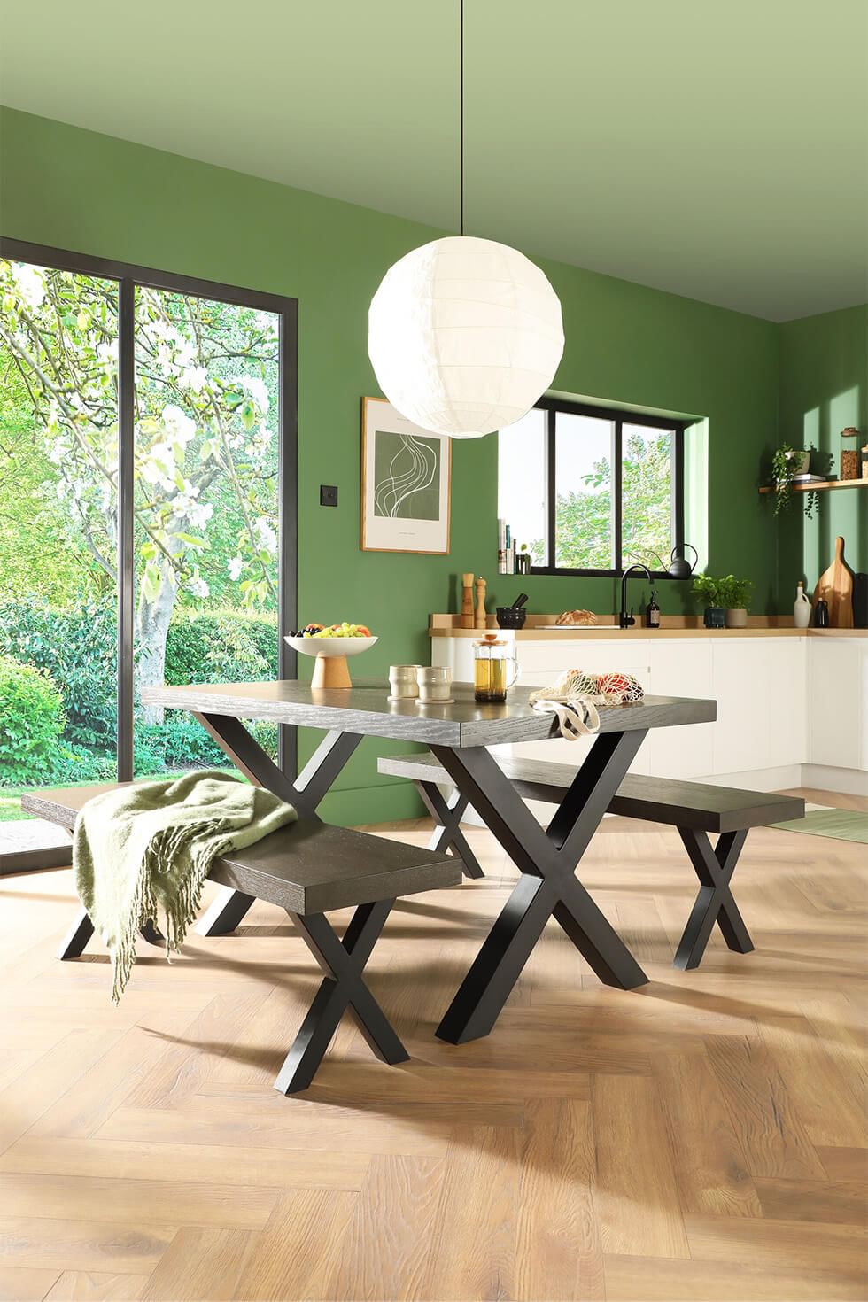 Open plan kitchen featuring wooden dining set and pendant light