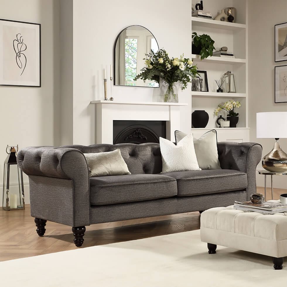 Grey Chesterfield sofa in a cosy neutral living room